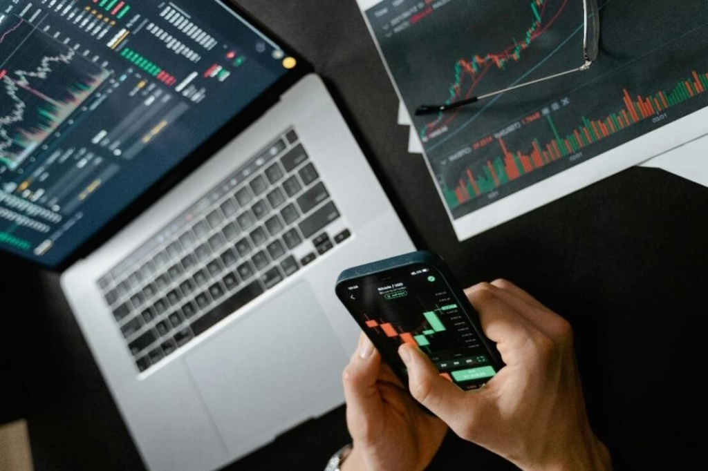 Person using a smartphone to view a digital asset portfolio